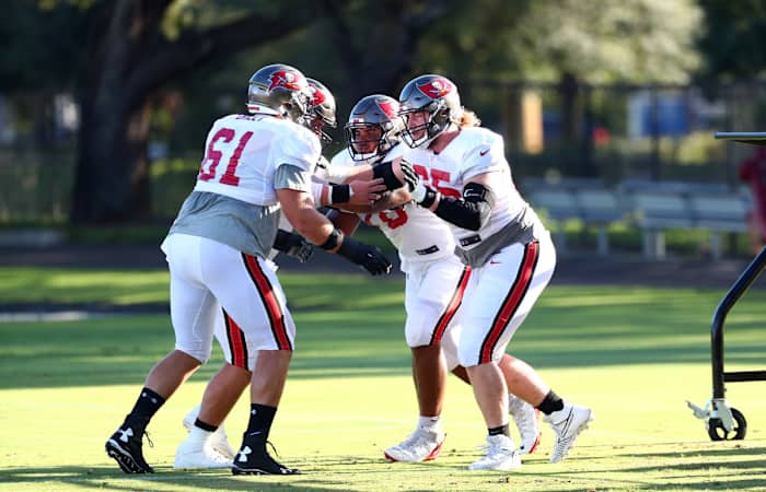 Aug 27, 2020; Tampa, Florida, USA; Tampa Bay Buccaneers guard Alex Cappa (65), offensive tackle Tristan Wirfs (78), guard Zack Bailey (61) work out at AdventHealth Training Center. Mandatory Credit: Kim Klement-USA TODAY Sports